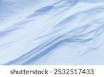 Natural winter texture of snow white crust on frozen Baikal Lake in cold day. Abstract white and blue snowy textured background in form of frozen waves. Blank, copy space, mock up, flat lay, top view