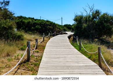 Natural Wood Footbridge On The Beach On The Way To The Sea