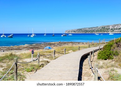 Natural Wood Footbridge On The Beach On The Way To The Sea