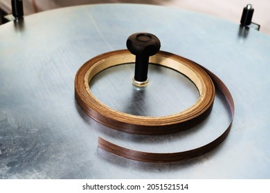 Natural Wood Furniture Edge Is Placed On A Metal Table. Selective Focus