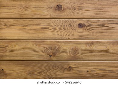Natural wooden brown background, rough texture of hardwood planks for floors and walls in the construction of the house