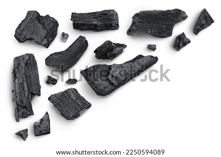 Natural wooden charcoal isolated on white background with full depth of field. Top view with copy space for your text. Flat lay