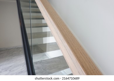 Natural Wooden Hand Railing On Glass