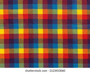 Natural wool fabric. Colored plaid fabric pattern background textured. Close-up colored fabric texture. Woolly olored plaid fabric.
