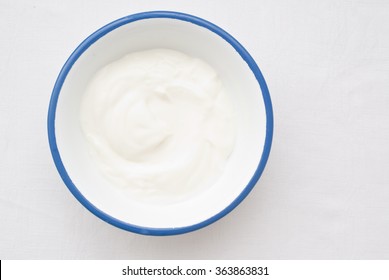 Natural Yogurt - Close Up Of A Bowl From Above - Studio Shot