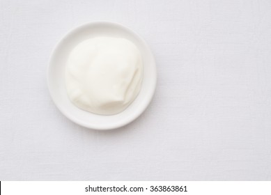 Natural Yogurt - Close Up Of A Bowl From Above - Studio Shot