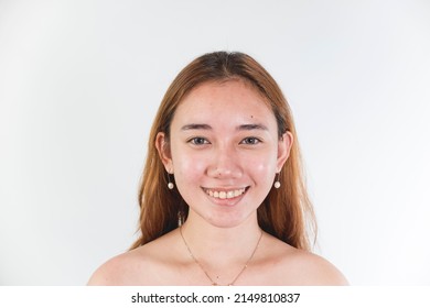 A Naturally Beautiful And Proud Southeast Asian Woman In Her Late Teens Without Makeup And Dyed Hair. Pretty Cute Face Isolated On A White Backdrop.