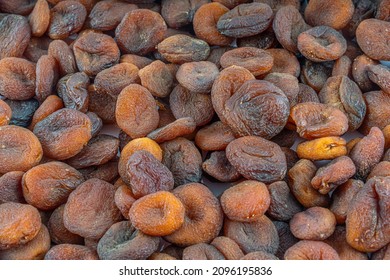 Naturally Dried apricots color orange. Dried apricots in the background