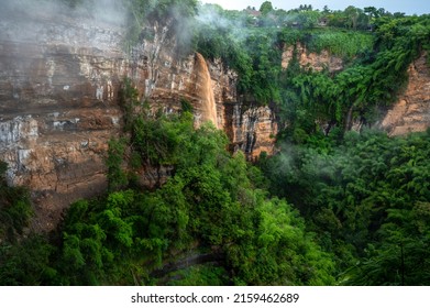 The naturally occurring rocky cliffs are covered with lush greenery on foggy days. Caused by changes in the earth's crust at canyon Nam Nao in Phetchabun Province unseen Thailand. - Powered by Shutterstock