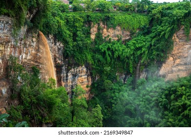 The naturally occurring rocky cliffs are covered with lush greenery on foggy days. Caused by changes in the earth's crust at canyon Nam Nao in Phetchabun Province unseen Thailand. - Powered by Shutterstock