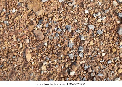 Naturally Small Gravel, Rubble Stone or Crushed Stone on The Ground.