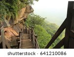 Nature backgrounds /Dramatic clouds with mountain and tree: Pha Mo e- Daeng  sisaket  Thailand.