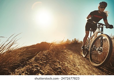 Nature, cycling and mountain bike with fitness, training and extreme sport at morning on dirt path. Bicycle, person and cardio of athlete with hill and exercise for workout outdoor with mockup - Powered by Shutterstock