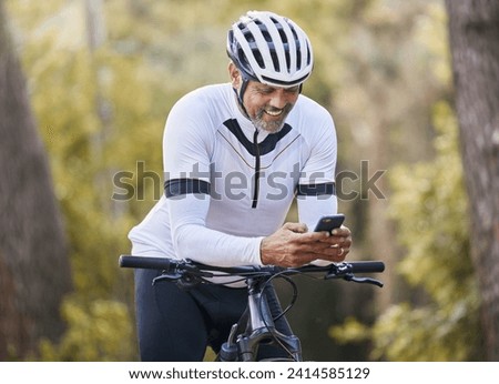 Nature cycling, phone and happy man, sports athlete or bike rider check digital map, GPS location or direction. Woods, cellphone and cyclist smile for online bicycle info, forest connectivity or app