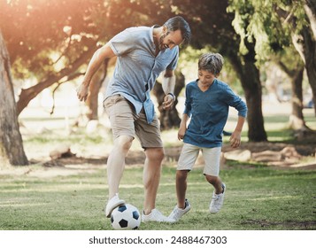 Nature, football and father playing with child in outdoor park practicing for sports game together. Fun, bonding and dad kicking soccer ball with boy kid for training in field or garden in Canada. - Powered by Shutterstock