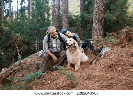 Nature, hiking and elderly couple with their dog in the forest for wellness cardio exercise. Happy, travel and senior man and woman hikers in retirement trekking with their pet in woods in Australia.
