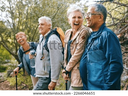 Nature, hiking and happy senior friends bonding, talking and laughing at comic joke in forest. Happiness, fun and group of elderly people trekking together for health, wellness and exercise in woods.