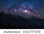 Nature landscape view of Himalayan mountain range with universe space of milky way galaxy and stars on night sky