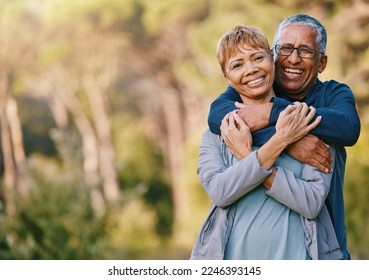 Nature, love and portrait of a senior couple hugging in a garden while on romantic outdoor date. Happy, smile and elderly people in retirement embracing in park while on a walk for fresh air together - Powered by Shutterstock