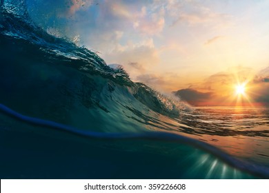 nature marine design postcard beautiful colored breaking surfing ocean wave rolling down at sunset time