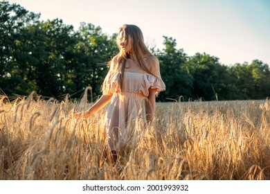 Nature Mental Health Benefits. Connection To Nature, Time Outside, Outdoor Day Off. Nature Deficit Disorder. Young Woman Enjoying Nature On Wheat Field At Sunset.