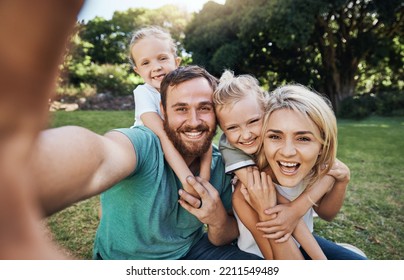 Nature, selfie and portrait of a happy family on a picnic together in outdoor green garden. Happy, smile and parents playing, hugging and bonding with children outside in backyard or park in canada. - Powered by Shutterstock