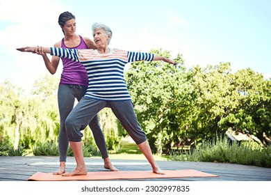 Nature, senior woman and yoga coach teaching exercise, coaching retirement workout or outdoor fitness. Personal trainer, wellness instructor and old person, yogi or people learning pilates training - Powered by Shutterstock