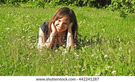 Similar – eine frau vor  einer blumenwiese. blumen pflücken