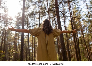 Nature, Spirituality And Supernatural Concept - Young Woman Or Witch Performing Magic Ritual In Forest