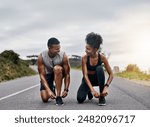 Nature, sports and couple tie shoelace in road with running exercise for race or marathon training. Fitness, outdoor and team of track and field athletes preparing for cardio workout in mountain.