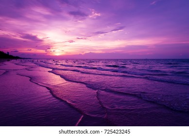 Nature in twilight period which including of sunrise over the sea and the nice beach. Summer beach with blue water and purple sky at the sunset. 