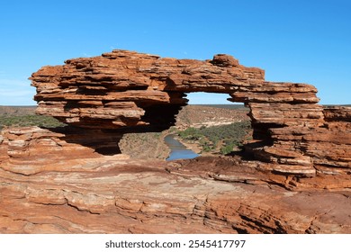 At the Nature's Window in Kalbarri National Park, this stunning natural rock arch frames offers a perfect blend of rugged landscape and tranquil scenery - Powered by Shutterstock