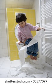 Naughty Boy Having Fun Making A Mess With Toilet Paper