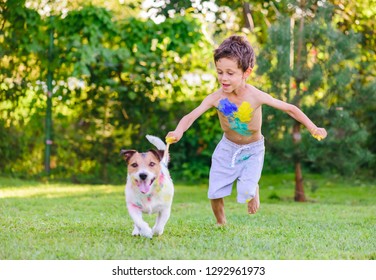 Naughty Boy Painting With Brush On Dog Trying To Escape