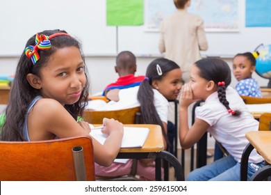 Naughty pupils in class at the elementary school - Powered by Shutterstock