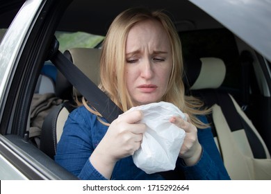 Nausea during a car trip. A blonde woman suffers from kinetosis. The concept of motion sickness in diseases of the transport and vestibular apparatus