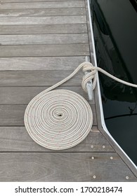 Nautical Rope Coiled Of Wooden Dock