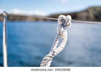 Nautical Sailor Knot On Stainless Steel Cable Railing -  Deck Of A Sailboat