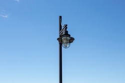 A Nautical Style Lantern On A Lamp Post.