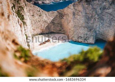 Navagio beach or Shipwreck bay. Turquoise sea water and white beach between huge rocky cliffs. Famous landmark location on Zakynthos island, Greece