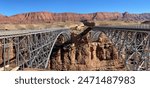 Navajo Bridge twin steel arch bridges crossing Marble Canyon and Colorado River in Glen Canyon National Recreation Area near Lees Ferry, Arizona. Historic bridge (now pedestrian) and new auto bridge.