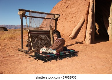 Navajo Child Sitting Next To Traditional Rug Making Tools