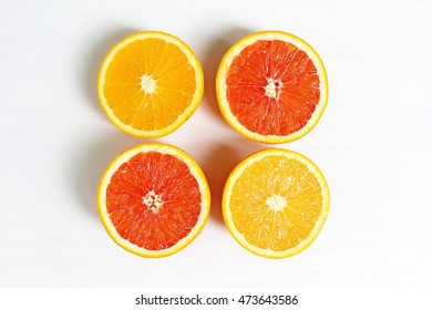 Navel And Valencia Oranges Fresh On White.