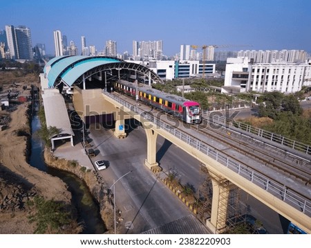 Navi Mumbai, India, 2023. Aerial shot of metro tracks in urban areas of navi Mumbai, taloja, kharghar with metro running on the tracks. A very useful addition to existing MAHA METRO rail network
