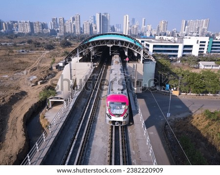 Navi Mumbai, India, 2023. Aerial shot of metro tracks in urban areas of navi Mumbai, taloja, kharghar with metro running on the tracks. A very useful addition to existing MAHA METRO rail network
