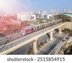 Navi Mumbai, India, 2024. Aerial shot of metro tracks in urban areas of navi Mumbai, taloja, kharghar with metro running on the tracks. A very useful addition to existing MAHA METRO rail network