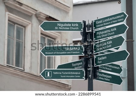 Navigation boards in Tallinn's Old Town provide direction info on St. Nicholas Church, Museum of Occupation, Toompea, Tourist Information Center, Port, Catherine's Guild, Railway Station and more