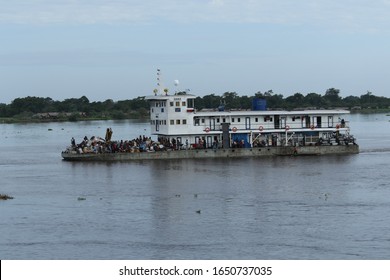 navigation on the Congo river 
transport on the Congo river economic activity on the Congo river sunset woman on dugout canoe women courage
