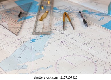 Navigation ship chart for building a sailing route. Plotter, divider, ruler and pen on a map.