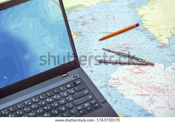 Navigation tools -\
sea map, pencil and\
divider